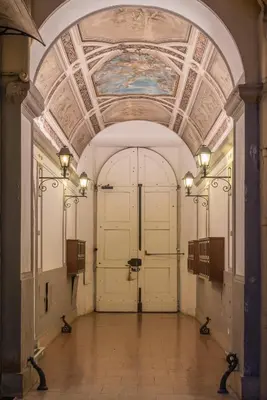 a large door in a building with a ceiling at Repubblica Apartment in Rome