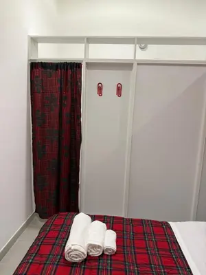 a bed with two white towels on top of it at La perla del Colosseo in Rome