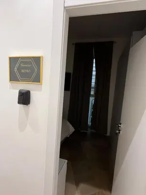 a hallway leading to a room with a door at Luxury apartments, Piazza di Spagna in Rome