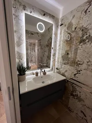 a bathroom with a sink and a mirror at Luxury apartments, Piazza di Spagna in Rome