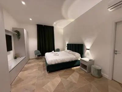 a bedroom with a bed and a table and chairs at Luxury apartments, Piazza di Spagna in Rome