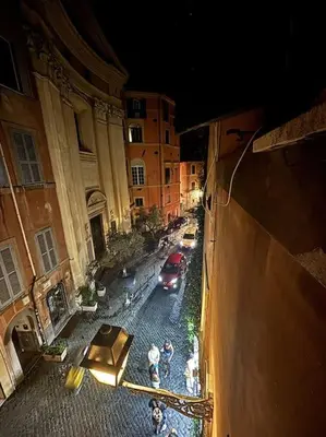an overhead view of a street with a red car at Scala 31 Trastevere in Rome