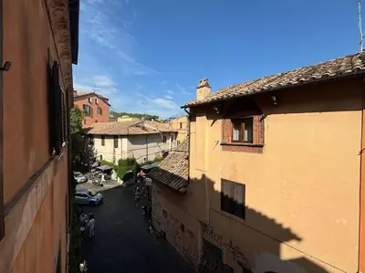 an overhead view of a city street with buildings at Scala 31 Trastevere in Rome