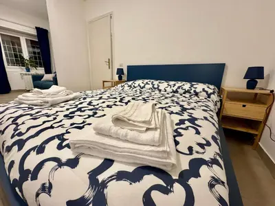 a bedroom with a bed with towels on it at Trastevere Cozy Retreat in Rome