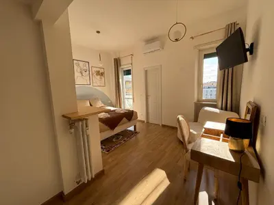a small living room with a couch and a table at Living Rome Flaminio - Appartamento parziale - Alloggio ad uso turistico in Rome
