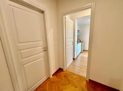an empty room with a door and a hallway at Living Rome Flaminio - Appartamento parziale - Alloggio ad uso turistico in Rome