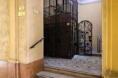 an entrance to a building with a wrought iron gate at Mega Royal Suite in Rome