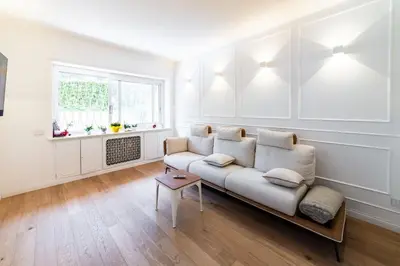 a living room with a couch and a window at Vatican Home 168 in Rome