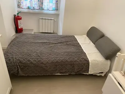 a bedroom with a large bed in a room at Il diamante del Colosseo in Rome