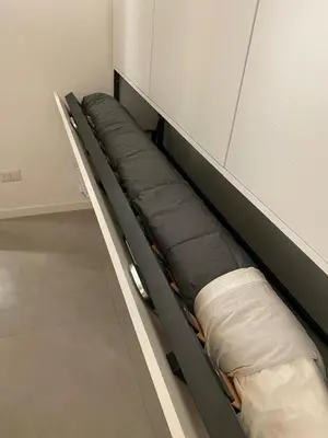 a shelf in a room with pillows on it at Il diamante del Colosseo in Rome
