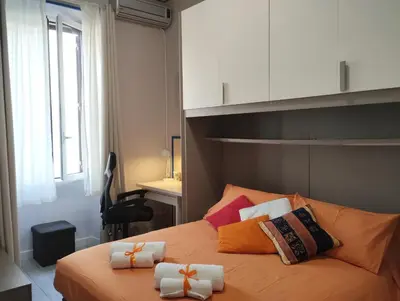 a bedroom with a bed with towels on it at La Casetta di Nonna Ro al Testaccio in Rome