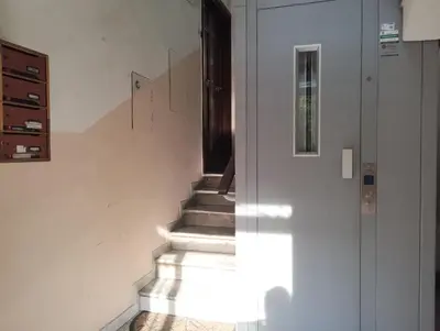 a staircase leading up to a door in a house at La Casetta di Nonna Ro al Testaccio in Rome