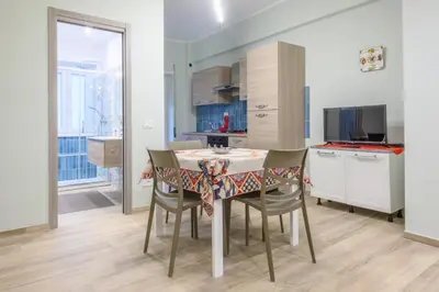 a kitchen and dining room with a table and chairs at 