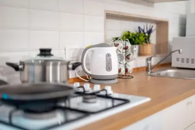 a tea kettle sitting on top of a stove in a kitchen at MichaelHouse in Rome