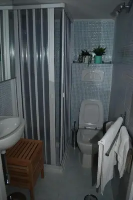 a bathroom with a white toilet and a sink at Affitti brevi Colosseo 2 in Rome