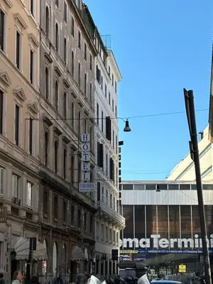 a group of buildings on a city street at Affitti brevi Colosseo in Rome