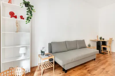a living room with a couch and a table at Trieste Home! in Rome