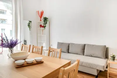 a living room with a table and a couch at Trieste Home! in Rome