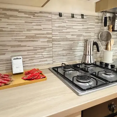 a kitchen with a stove and a counter top at Trieste Home! in Rome