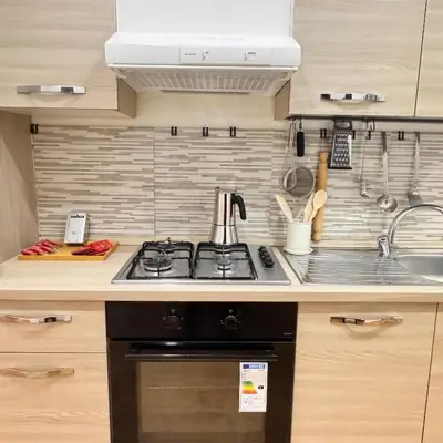 a kitchen with a stove and a sink at Trieste Home! in Rome
