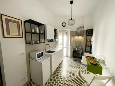 a living room with a couch and a flat screen tv at La Magnolia Monteverde Apartment in Rome