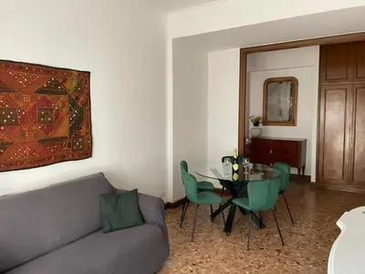 a bathroom with a white toilet and a mirror at La Magnolia Monteverde Apartment in Rome