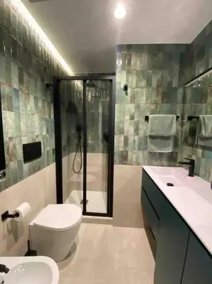 a bathroom with a toilet and a shower and a sink at Casa Anacapri in Rome