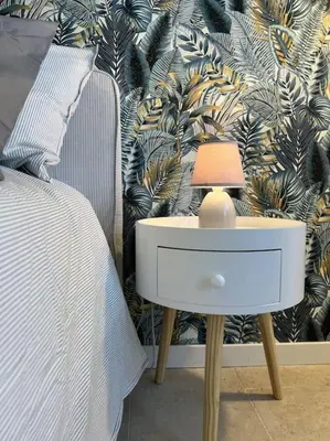 a bedroom with a bed and a table with a lamp at Peter House in Rome
