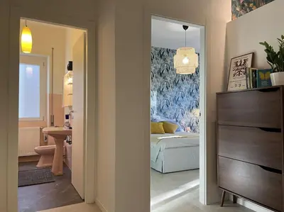 a room with a bedroom with a bed and a mirror at Peter House in Rome