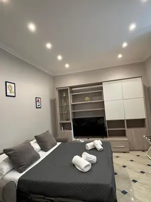 a bedroom with a bed with two towels on it at Ezio29 Holiday House in Rome