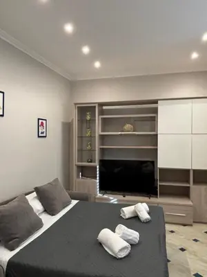 a bedroom with a bed with two towels on it at Ezio29 Holiday House in Rome