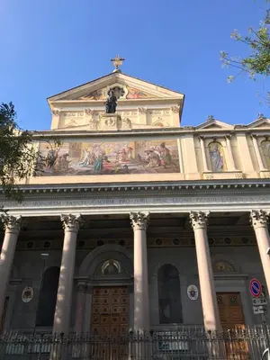 a building with paintings on the top of it at Ezio29 Holiday House in Rome