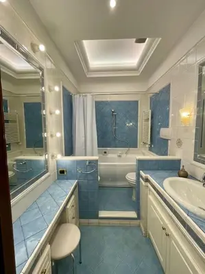 a bathroom with a toilet and a tub and a sink at Ezio29 Holiday House in Rome
