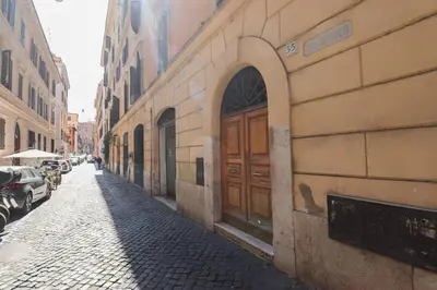 a building with a door on the side of a street at Appartamento in via Plauto in Rome