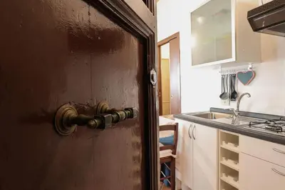an open door to a kitchen with a sink at Appartamento in via Plauto in Rome