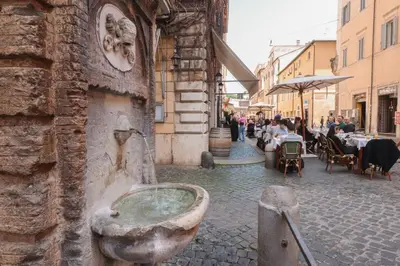 a stone sink on the side of a building at Appartamento in via Plauto in Rome