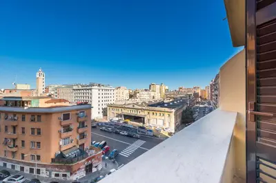 a living room with a table and chairs at Apartment in Tuscolana Train Station & Metro A in Rome