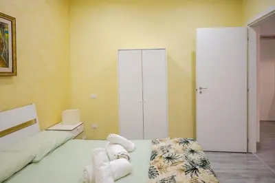 a bedroom with a bed with towels on it at Roma centro Vicino al Vaticano - Free WiFi in Rome