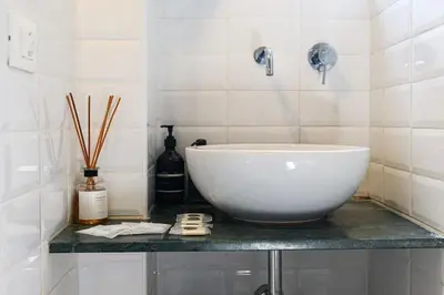 a bathroom with a large bowl sink on a counter at Casa Sardi in Rome