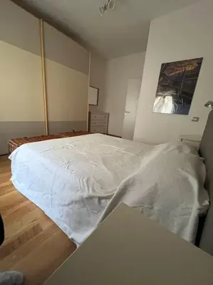 a bedroom with a large white bed in it at My Home in Rome in Rome