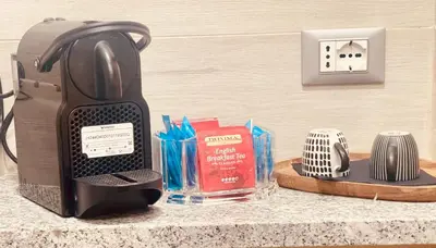 a toaster sitting on a counter next to a switch at THE BREAK - Campo Marzio Studio in Rome