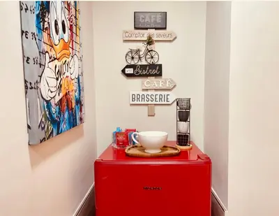 a red cabinet with a bowl on top of it at THE BREAK - Campo Marzio Studio in Rome