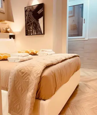 a bedroom with a bed with towels on it at THE BREAK - Campo Marzio Studio in Rome
