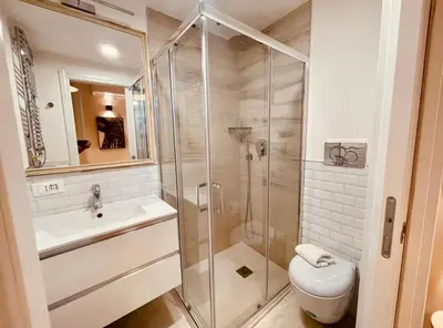 a bathroom with a shower and a toilet and a sink at THE BREAK - Campo Marzio Studio in Rome