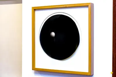 a picture of a black eyeball in a white frame at Art Apartment Rome City Center in Rome