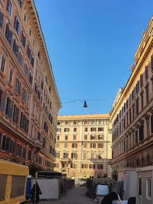 a large building in the middle of two buildings at Appartamento Gracchi 15 in Rome