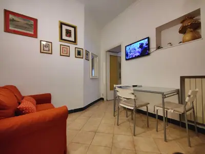 a living room with a couch and a table at Appartamento Gracchi 15 in Rome