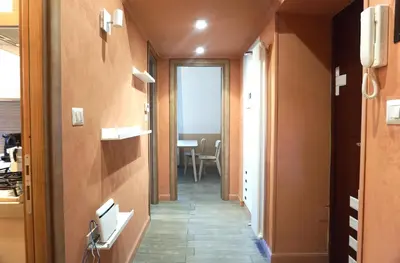 a hallway leading to a room with a table at Cozy Apartment in the heart of Garbatella in Rome