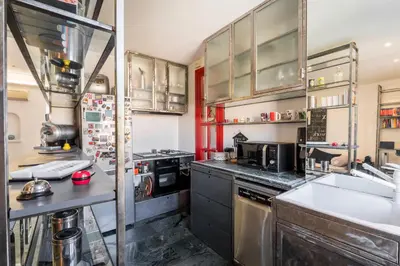 a kitchen with a sink and a stove at Comics Roma Penthouse, Funny Flat Nearby Colosseum in Rome