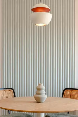 a dining room table with aendant light and chairs at Sangió - Lovely Home in Rome in Rome